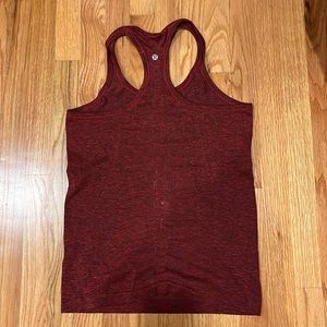 Maroon swiftly tech racer back tank top. Size 6. Good condition.